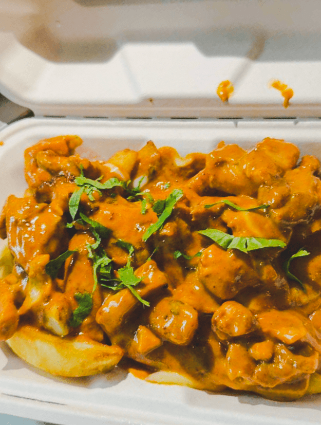 Punjabi Bytes loaded fries topped with curry and fresh coriander