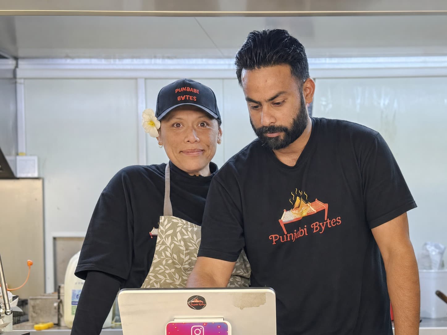 The Punjabi Bytes family inside their Woodridge food trailer